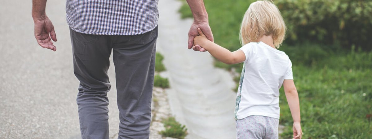 Dad and child walking