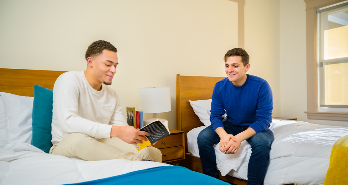 Roommates in a bedroom with twin beds.