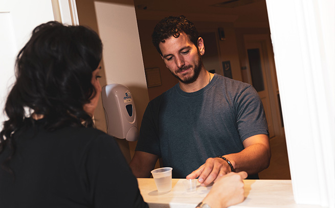 patient with a nurse getting medications in Boston